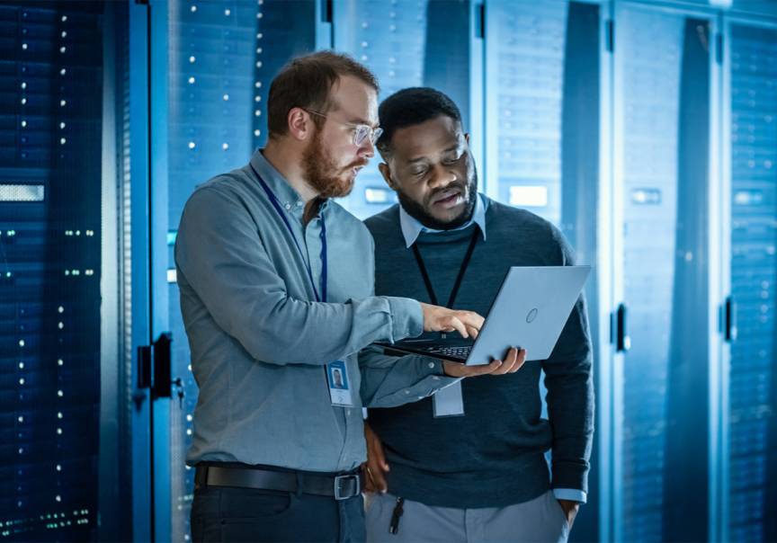 A person bending over to an ICT Expert for Advice